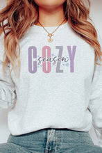 Load image into Gallery viewer, a woman wearing a sweatshirt that says cozy