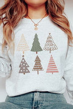Load image into Gallery viewer, a woman wearing a sweater with christmas trees on it