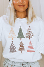 Load image into Gallery viewer, a woman wearing a white sweatshirt with christmas trees on it