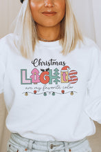 Load image into Gallery viewer, a woman wearing a white christmas sweatshirt and a black beanie