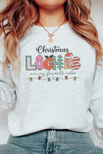 Load image into Gallery viewer, a woman wearing a christmas sweater and jeans
