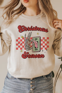 a woman wearing a christmas season sweatshirt