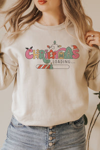 a woman wearing a sweatshirt that says christmas loading