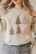 Load image into Gallery viewer, a woman wearing a sweater with christmas trees on it